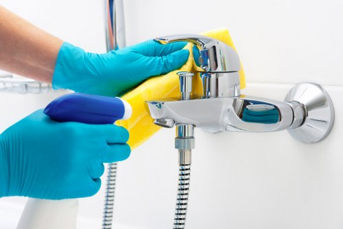Technician applying carpet cleaning procedures with safety awareness
